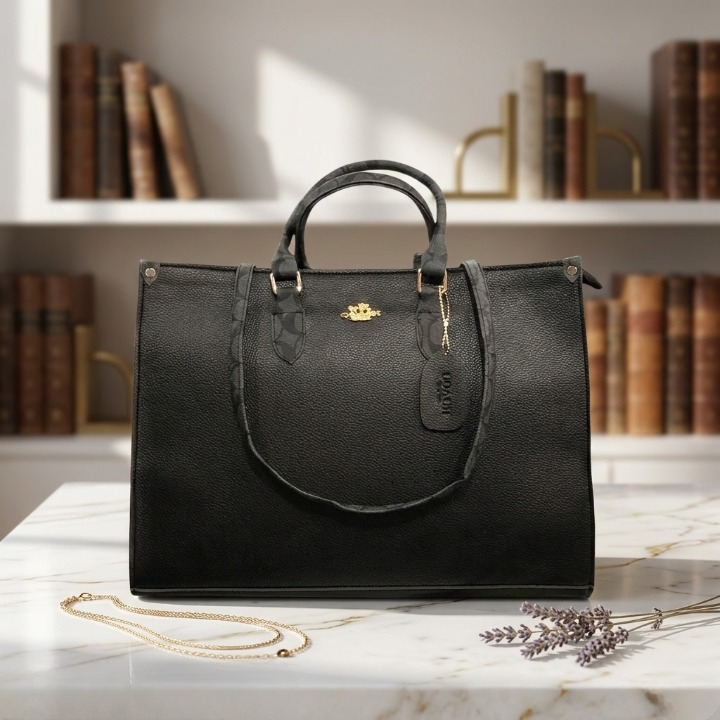 The Classic Black variant of the Range Studio Accordion Carryall displayed in an elegant, aesthetic library backdrop setting.