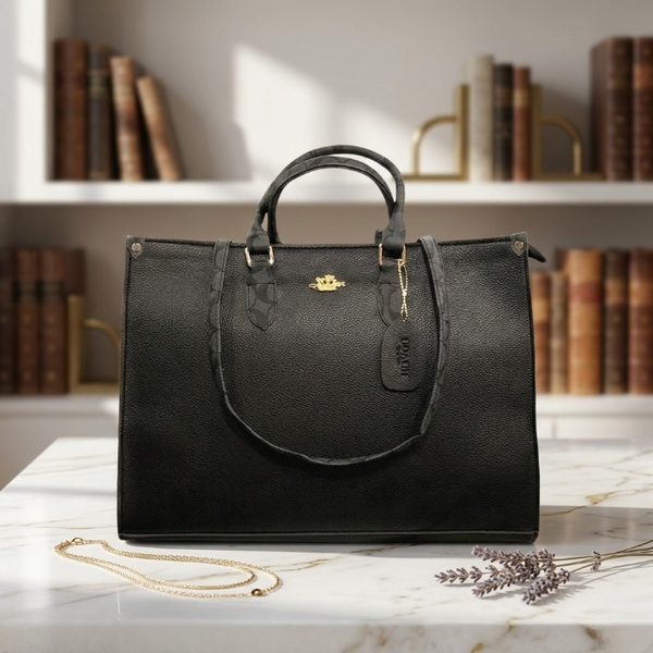 The Classic Black variant of the Range Studio Accordion Carryall displayed in an elegant, aesthetic library backdrop setting.