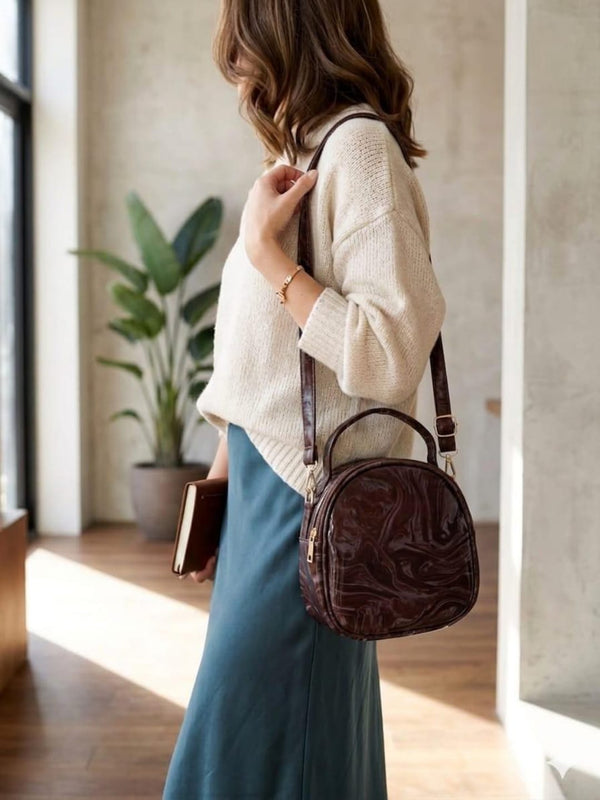 Artisanal deep espresso dark brown circular creation showcasing a rich fluid marbled surface layout tailored for contemporary wardrobes.