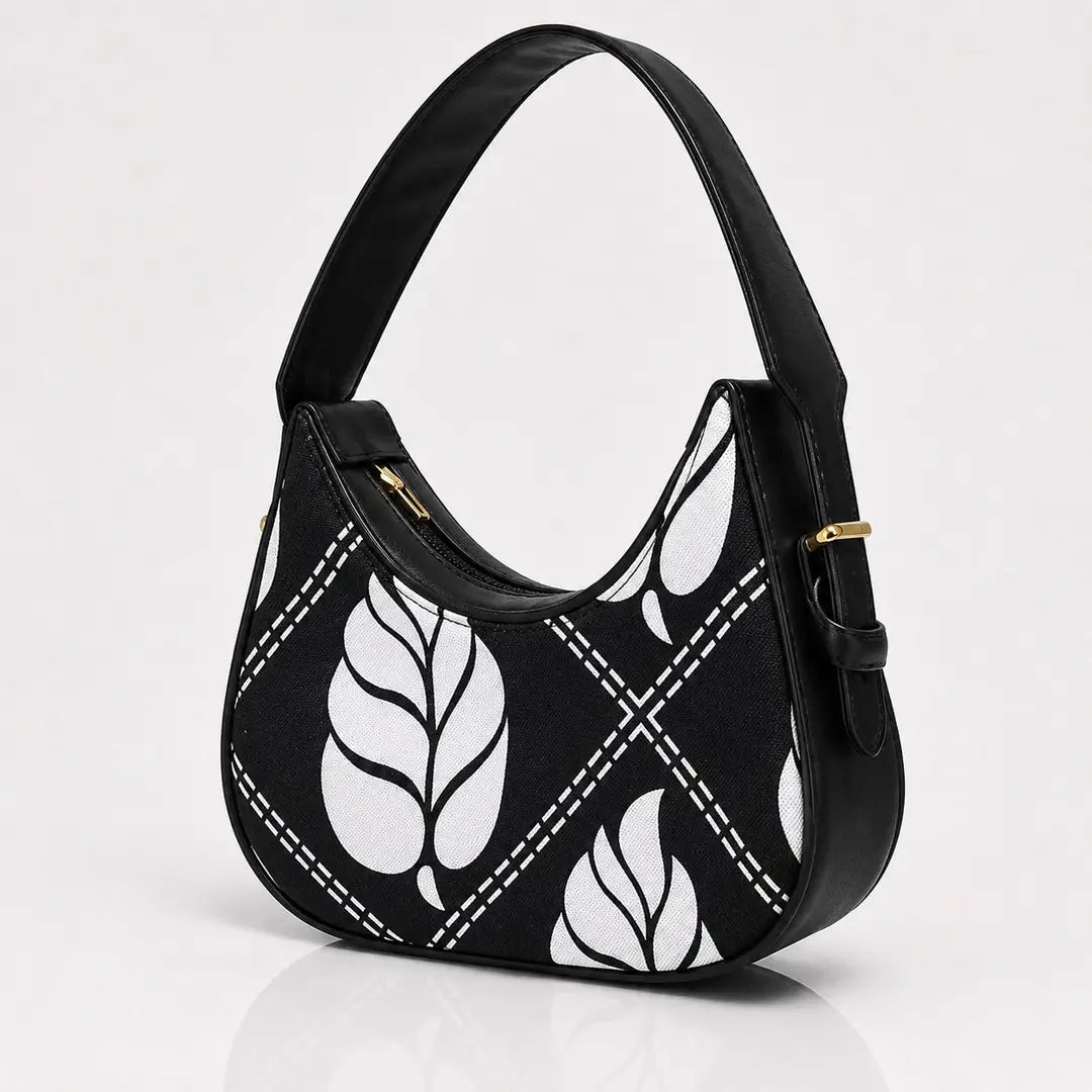 The sleek jet black variation of our floral canvas hobo piece packaged cleanly for a hand-crafted unique and trend in aesthetics look.
