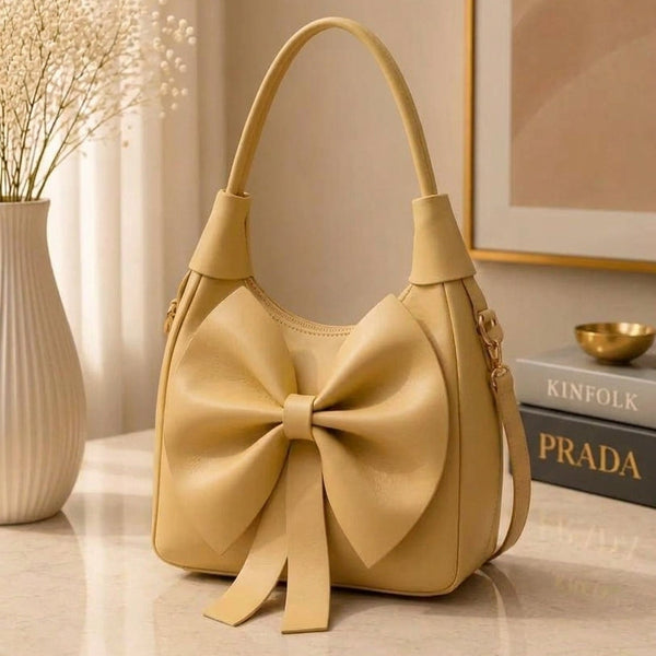 Warm mustard yellow leather artisanal creation displaying its durable top handle strap construction and clean edges.