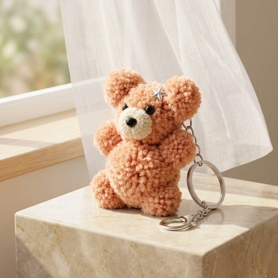 Artisanal cloud-soft teddy pom charm in royal purple reflecting an elegant contemporary style for accessory accents.