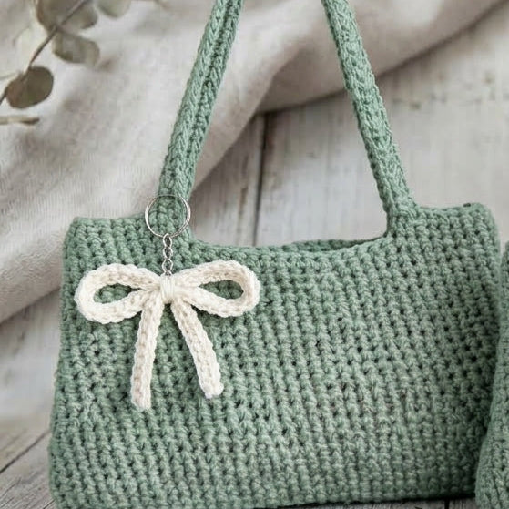 Artisanal woven textile creation in vibrant green highlighting a structured compact profile and detailed thread work.