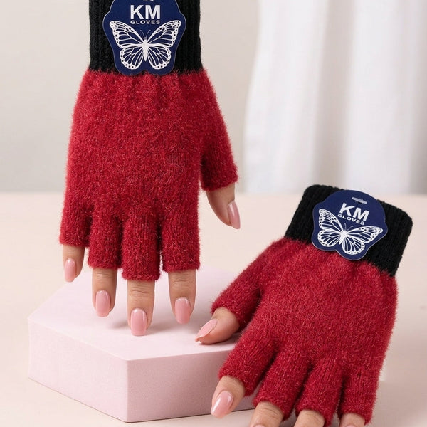 Front angle view of the Crimson Red variant Range Studio half-finger cut rabbit wool gloves with an onyx black ribbed cuff styled on a pastel display block 