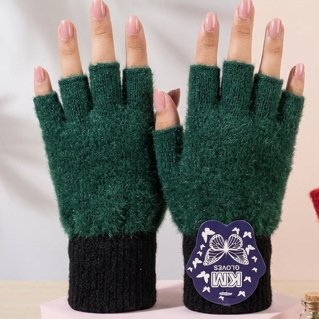 Aesthetic studio display of the Emerald Green variant Range Studio fingerless rabbit wool gloves next to a miniature glass jar accessory