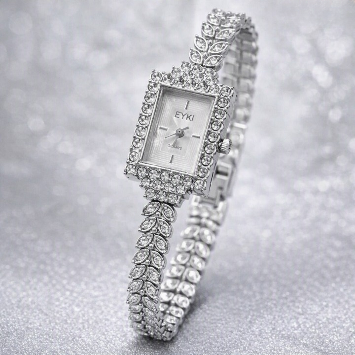 Side angle view of the high-shine Classic Silver variant Range Studio vintage rhinestone watch on a glittering backdrop surface.