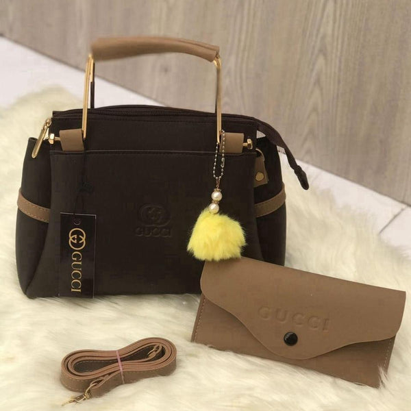 Close-up display of the earth-toned classic brown premium top-handle accessory set with a minimalist design for versatile styling.