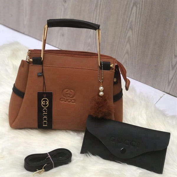 Close-up display of the earth-toned classic brown premium top-handle accessory set with a minimalist design for versatile styling