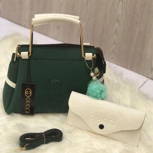 Front view of the vibrant emerald green hand-crafted top-handle accessory set showcasing a rich texture and smooth rexine finish