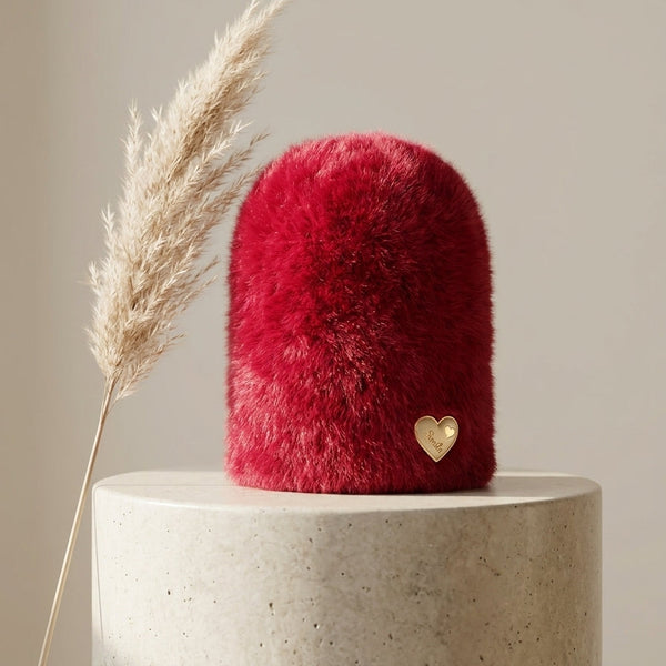 Front profile of the Crimson Ruby wine red plush rabbit wool beanie from Range Studio showing the thick fabric texture and gold heart detailing.