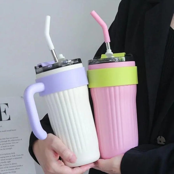 Side perspective view of the Lilac and Turquoise variant of the Range Studio Signature Ribbed Travel Tumbler.